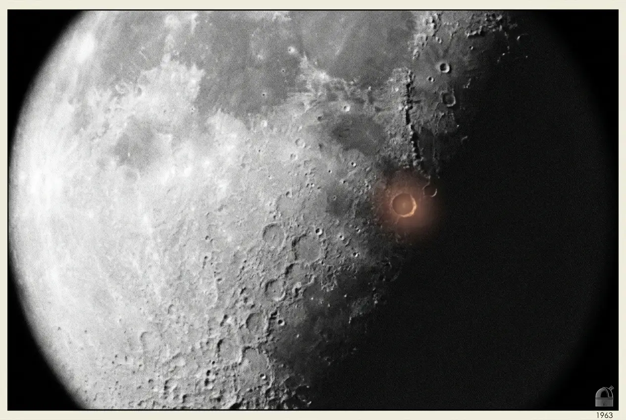 The crater Aristarchus glowing with a faint red-pink luminescence against the grey lunar surface