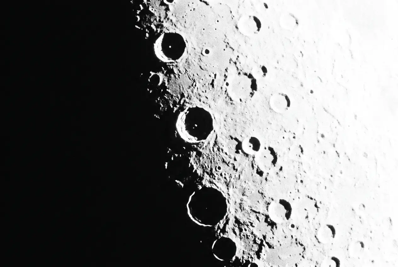 The lunar terminator: blazing daylight meeting profound darkness across a cratered surface